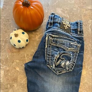 Men’s destructed Rock Revival jeans